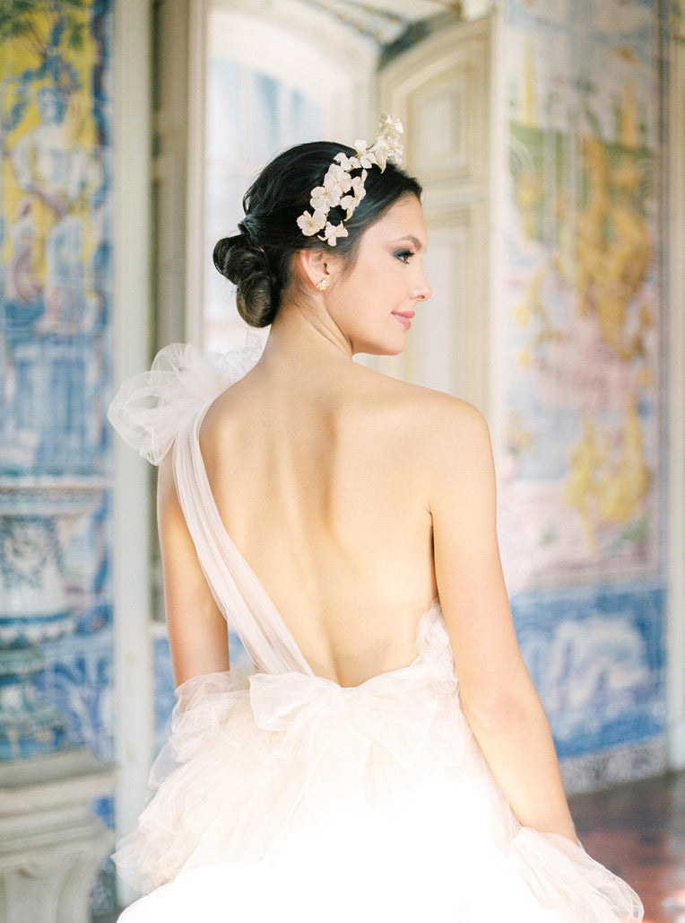 The timeless allure of a bride's handcrafted Cremilde Bispo Jewellery Muse I wedding dress is captured from the back.