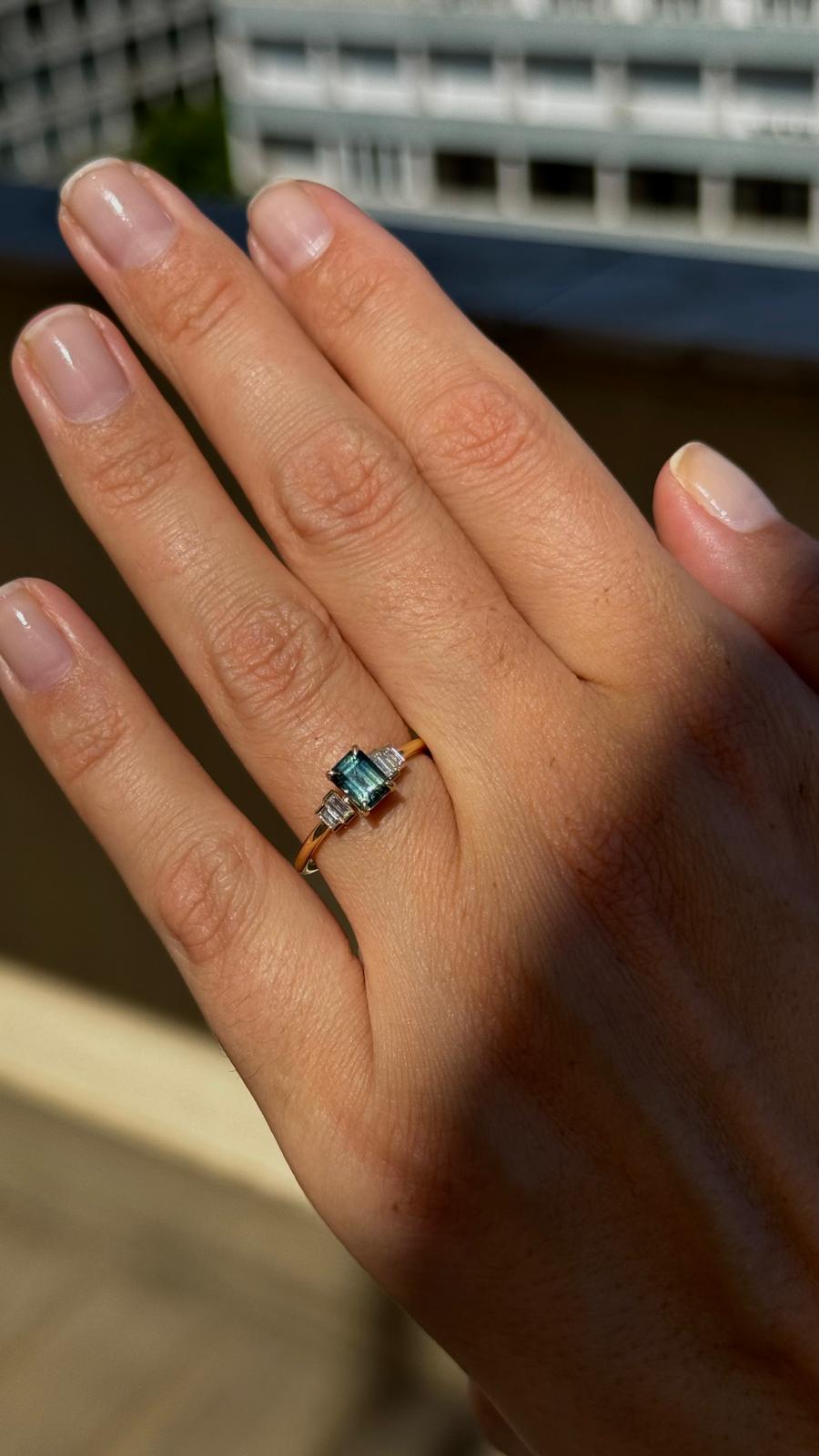 Alice Emerald Cut Australian Sapphire & Baguette Diamonds Engagement Ring on hand