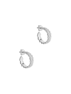 Maximum style with minimal effort - Cremilde Bispo Jewellery's Essential Leaf Hoops in Silver, on a gray background, showcasing leaf-like carved details..