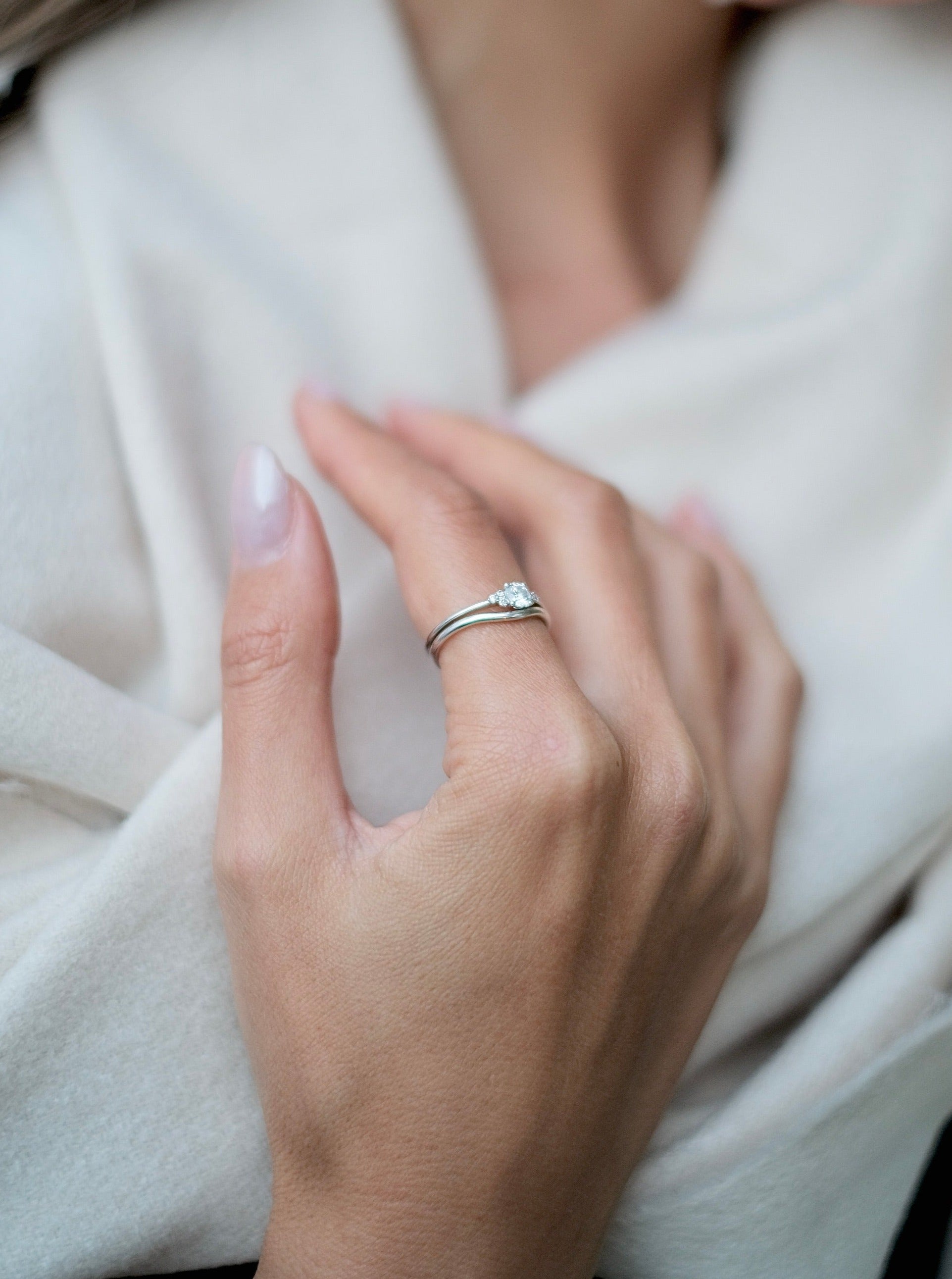 A woman wearing a bespoke engagement ring with a Cremilde Bispo Jewellery 18k GOLD Hera Diamonds Ring.