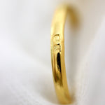Gold- plated ring with two stamped Hallmarks.