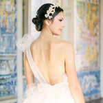 The timeless allure of a bride's handcrafted Cremilde Bispo Jewellery Muse I wedding dress is captured from the back.