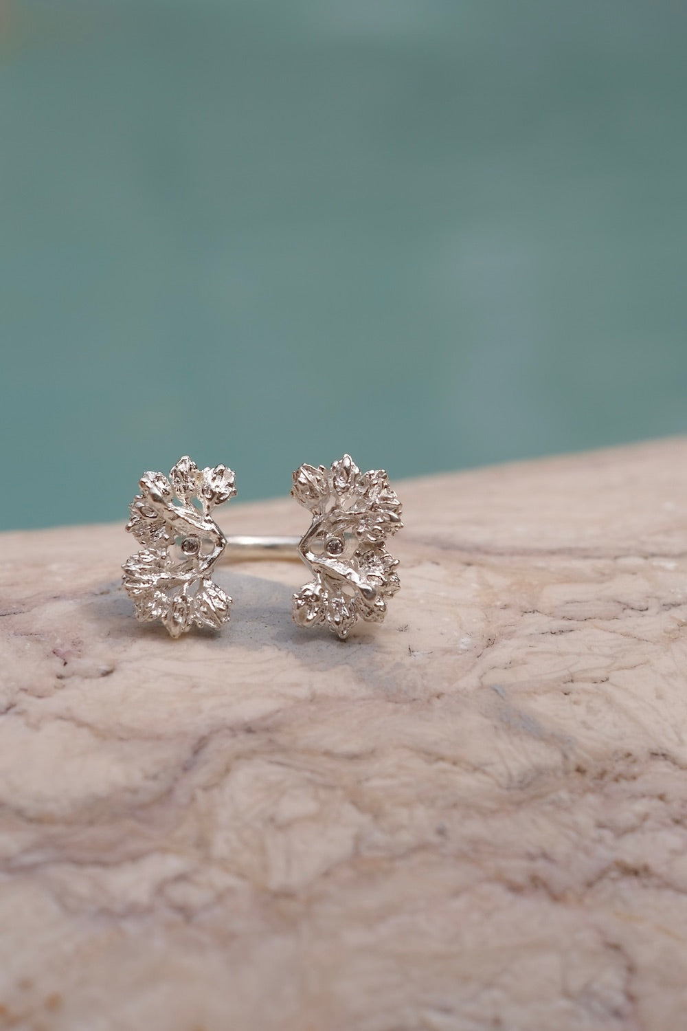 Hand-crafted w/ floral foliage & two Swarovski zirconias, The Garden Ring exudes exquisite artistry. Showcasing nature's beauty, this exclusive & unparalleled piece is a must-have, adjustable to fit any finger.