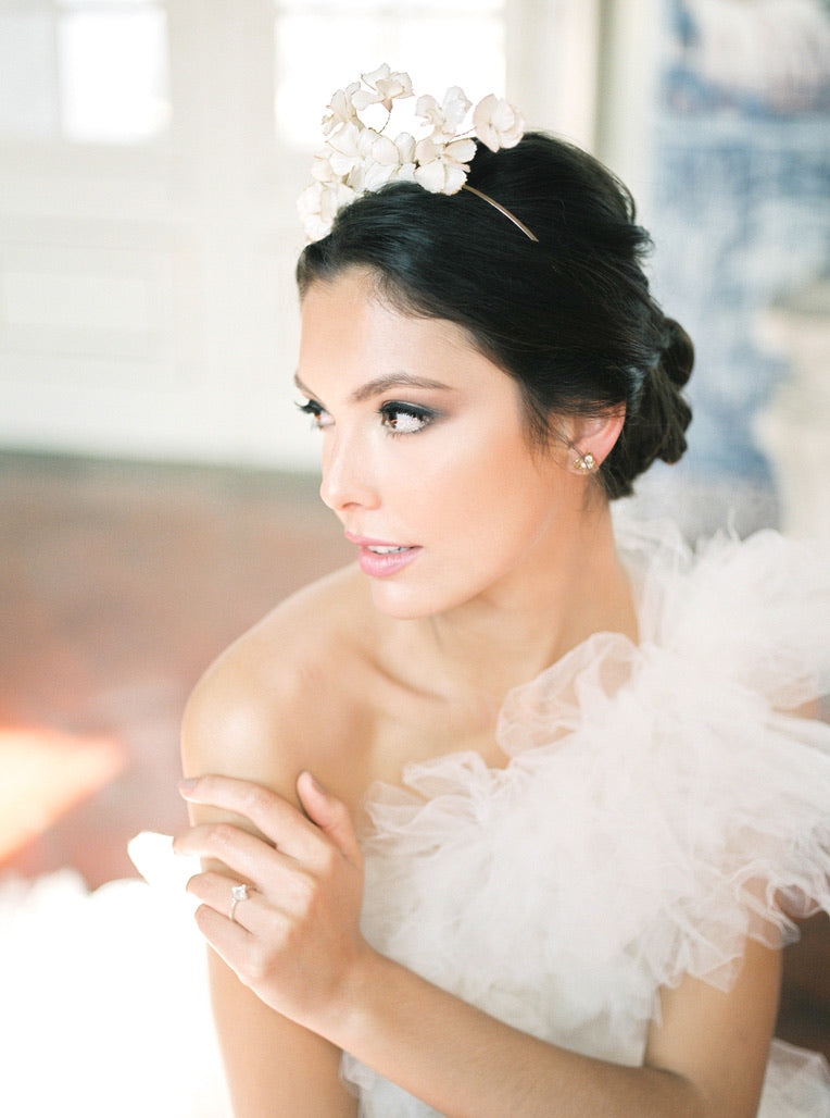 A timeless bride in a handcrafted white dress with a luxurious Cremilde Bispo Jewellery Muse I tiara.