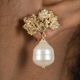 A woman's ear with the Pearly Forest Earrings GP by Cremilde Bispo Jewellery.