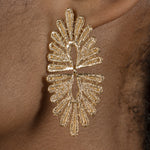 A vintage-inspired Cremilde Bispo Jewellery woman's ear with The Guipure GP earring, showcasing lace artistry.