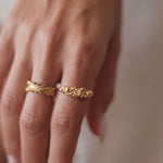 A woman's hand adorned with a beautiful Cremilde Bispo Jewellery Blooms Ring GP, showcasing its premium quality and capturing the essence of nature's beauty.