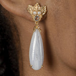 A woman's ear with The Muse III Chalcedony earring adorned with cultured fresh-water pearls from Cremilde Bispo Jewellery.