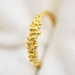 An 18K Yellow GOLD Essential Dot Ring from Cremilde Bispo Jewellery, featuring small gold balls for a stylish addition to your jewellery collection.
