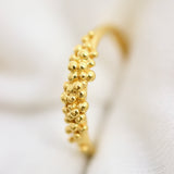 An 18K Yellow GOLD Essential Dot Ring from Cremilde Bispo Jewellery, featuring small gold balls for a stylish addition to your jewellery collection.