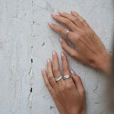 A woman's hands showcasing a bespoke Cremilde Bispo Jewellery 18k GOLD Hera Diamonds Ring.