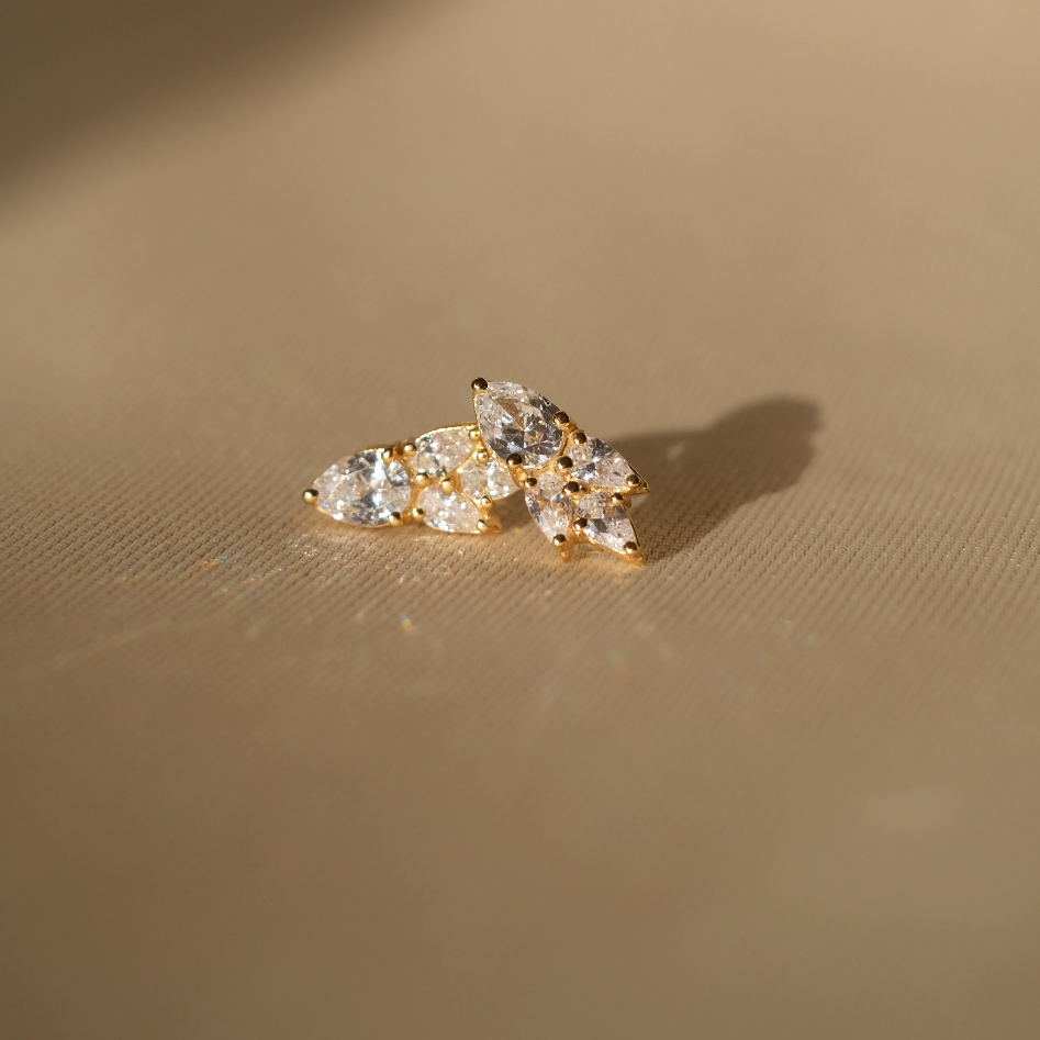 An Essential Drops Earring from the Lisbon jewelry collection by Cremilde Bispo Jewellery, made of gold-plated studs with white diamonds.