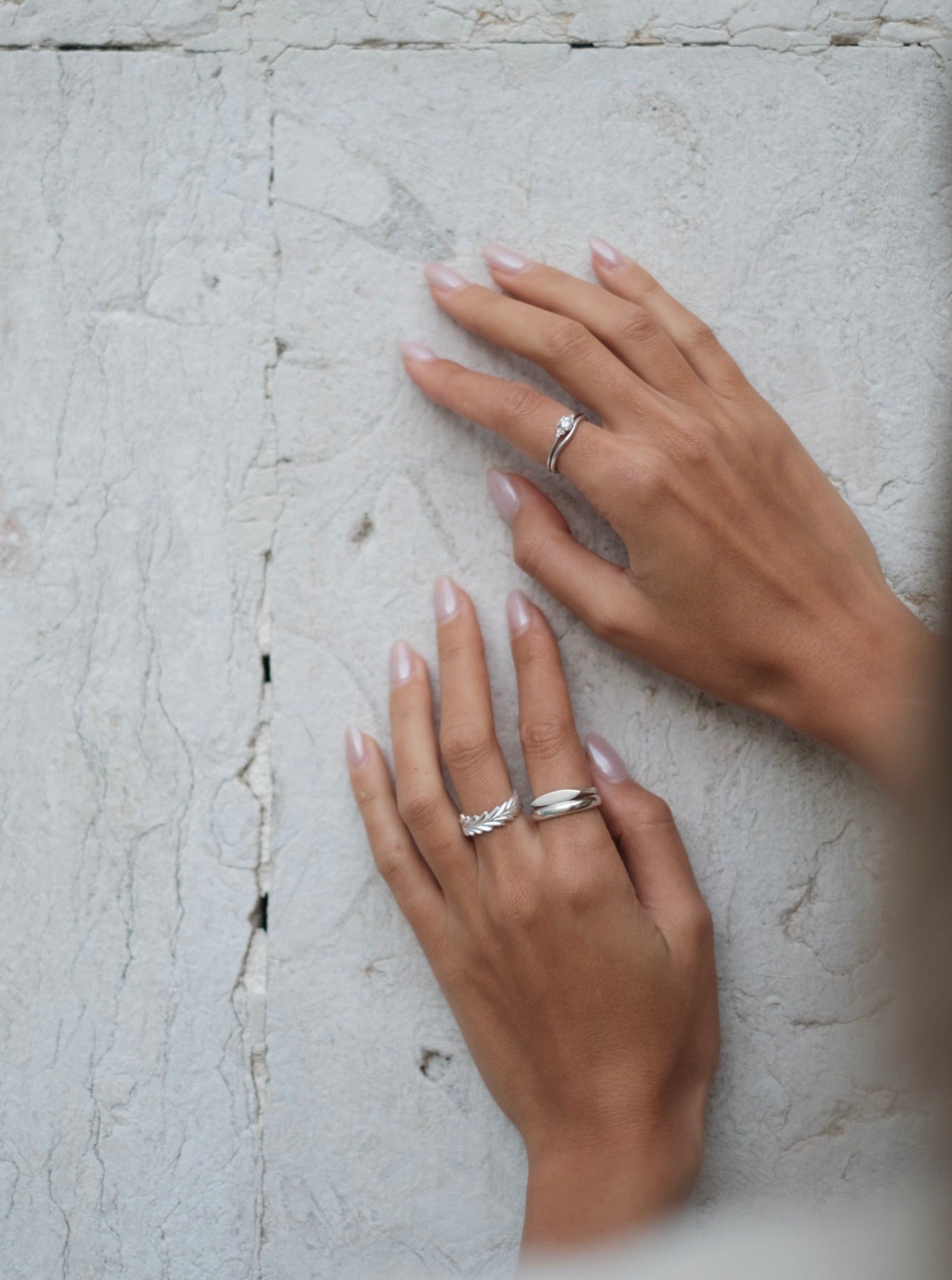 A woman's hands showcasing a bespoke Cremilde Bispo Jewellery 18k GOLD Hera Diamonds Ring.