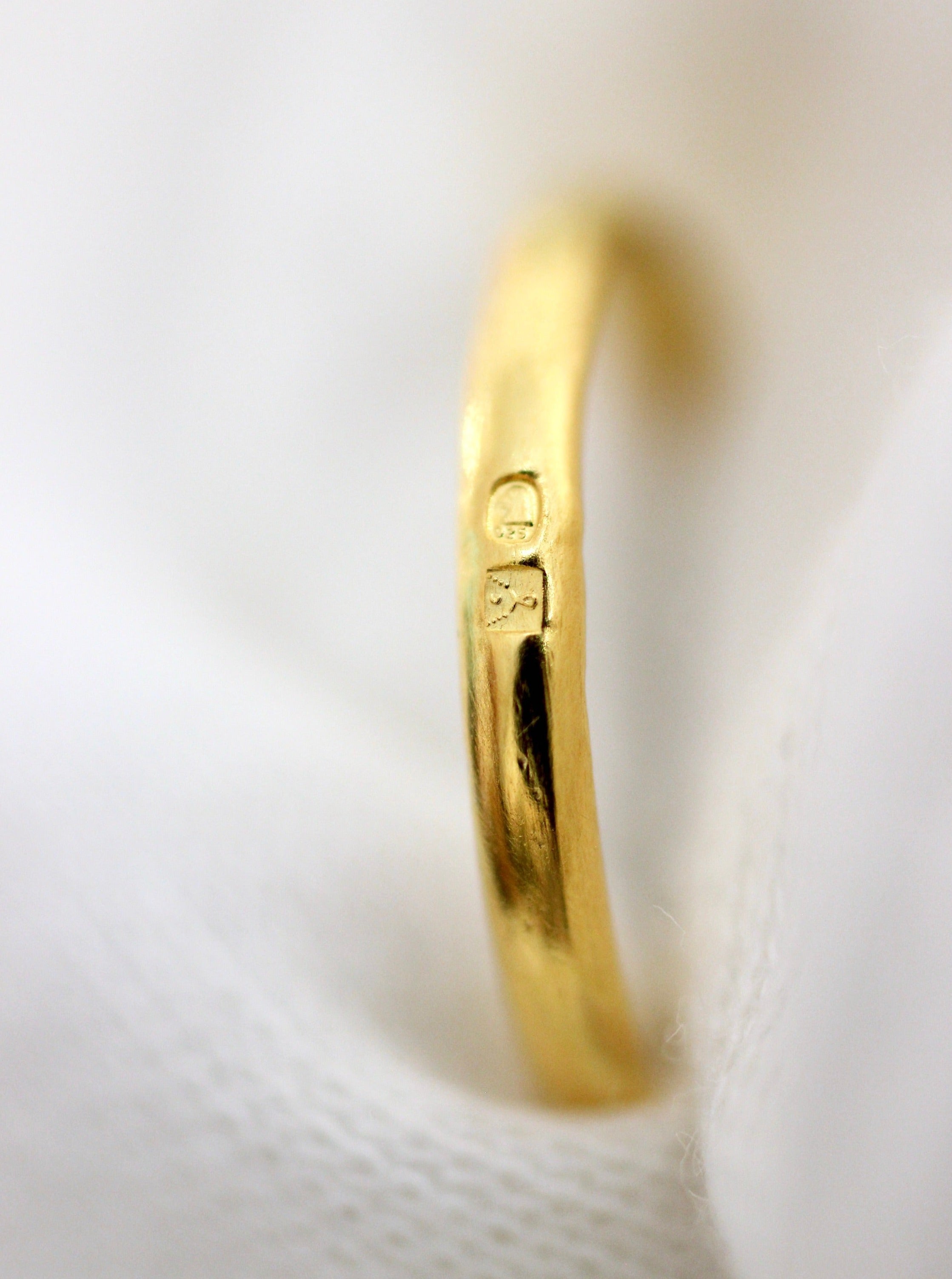 Gold- plated ring with two stamped Hallmarks.